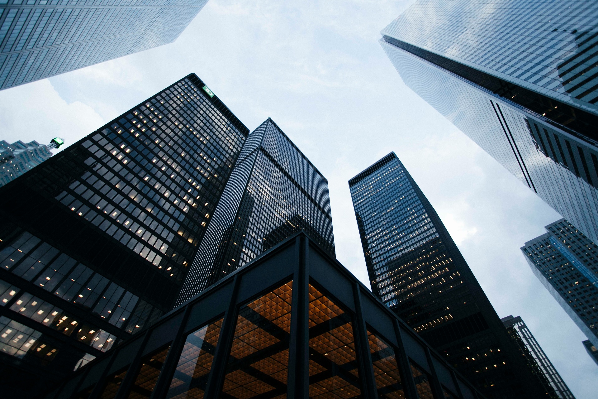 Modern glass skyscrapers reaching toward the sky
